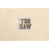 Yellow and black Yeehaw iron-on patch for a fun retro western vibe sticker